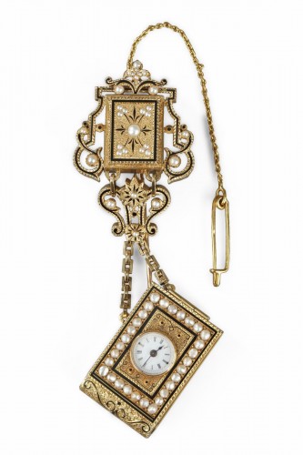 A 19th Century gold and enamel watch with associated chatelaine. 