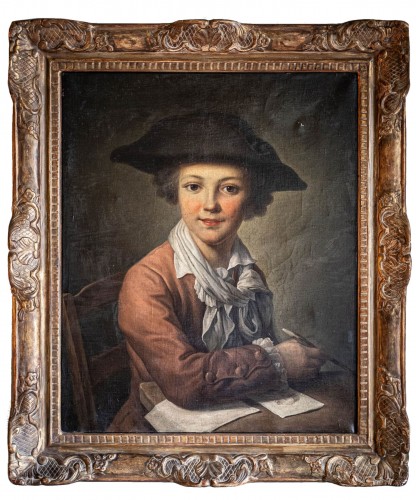 Portrait d’un jeune garçon dessinant