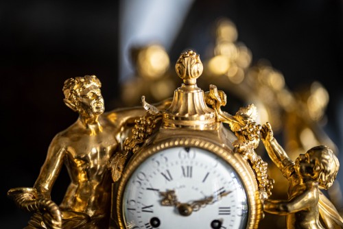 Gilded bronze clock representing a satyr and his child - Horology Style Transition