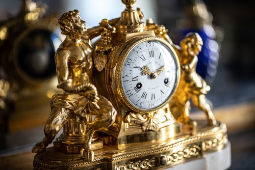 Horology  - Gilded bronze clock representing a satyr and his child