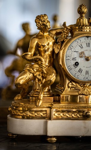 Gilded bronze clock representing a satyr and his child - 