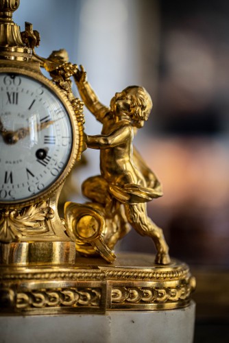 18th century - Gilded bronze clock representing a satyr and his child