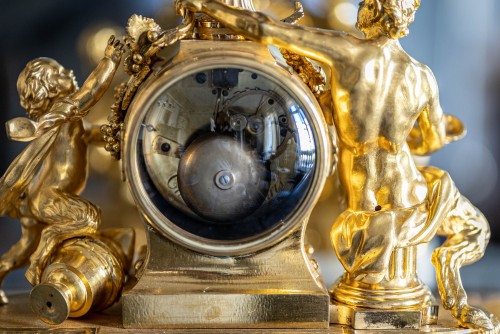 Gilded bronze clock representing a satyr and his child - Transition