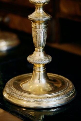 suite of four gilt bronze candlesticks - 