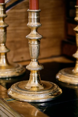 17th century - suite of four gilt bronze candlesticks