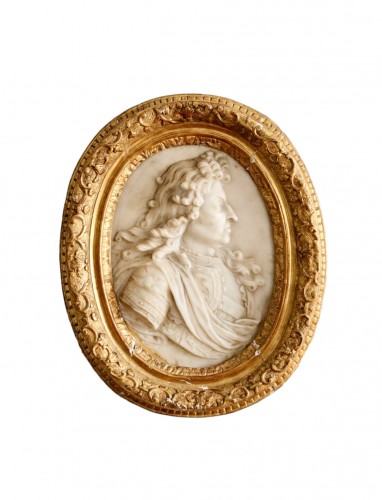 White marble oval medallion depicting Louis XIV in profile