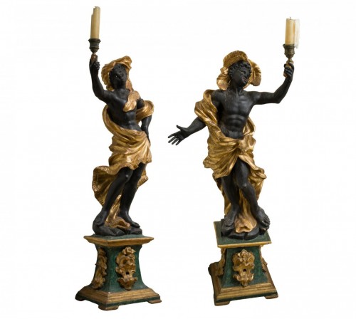 Large pair of carved, gilt, and patinated wooden torchères (candle stands)