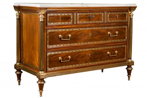 a giltbronze mounted flammed mahogany commode stamped Adam Weisweiler