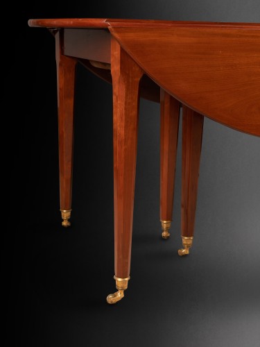A Louis XVI solid mahogany extending dining table - 