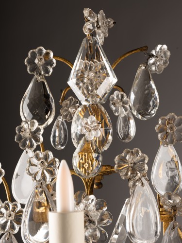 20th century - A pair of gilt-bronze and cut-crystal three-light girandoles