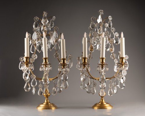  - A pair of gilt-bronze and cut-crystal three-light girandoles