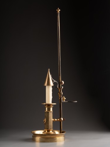 Lighting  - An Empire gilt-bronze candlestick with a mechanism