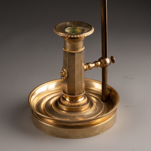 An Empire gilt-bronze candlestick with a mechanism - 