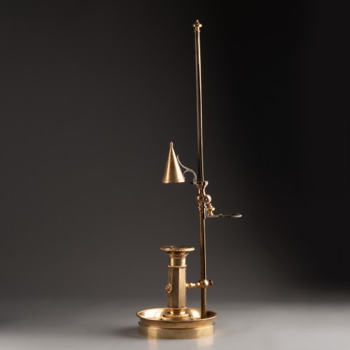 Antiquités - An Empire gilt-bronze candlestick with a mechanism