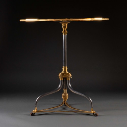 18th century - A late 18th century polished steel and giltbronze campaign gueridon