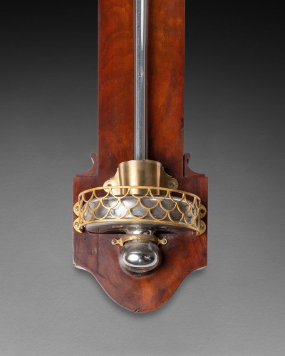Decorative Objects  - An Empire mahogany stick barometer