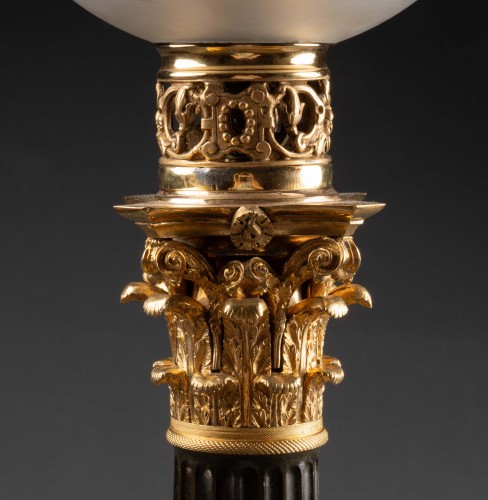 Antiquités - A pair of patinated and gilded bronze columnar Carcel lamps