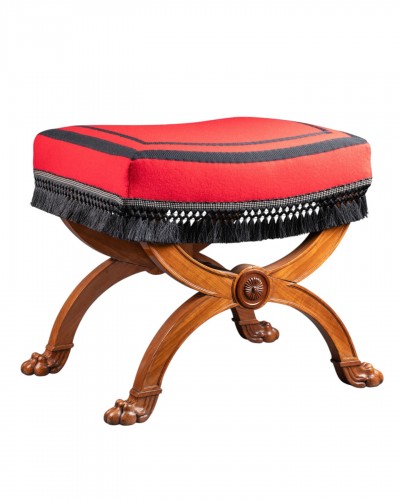 A Consulate period mahogany curule stool , with lion’s paw, by JB Demay