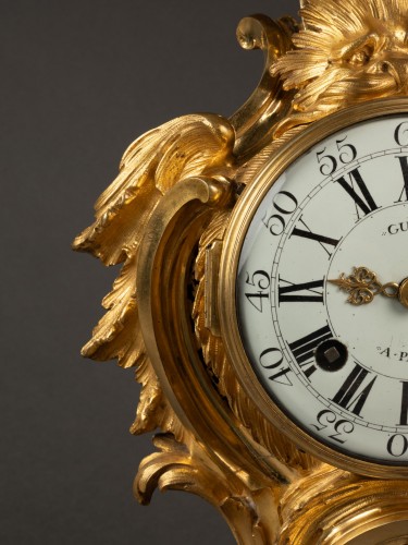 Horology  - A Louis XV gilt-bronze mantel clock by Gudin l'aîné