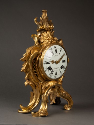 Antiquités - A Louis XV gilt-bronze mantel clock by Gudin l'aîné