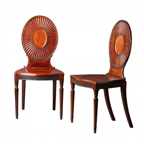 A pair of George III Mahogany Hall Chairs in the manner of Mayhew & Ince