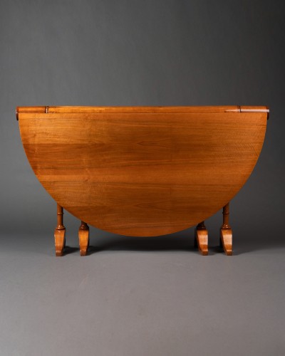 19th century - An early 19th century Biedermeier cherrywood Gateleg Table by 1820
