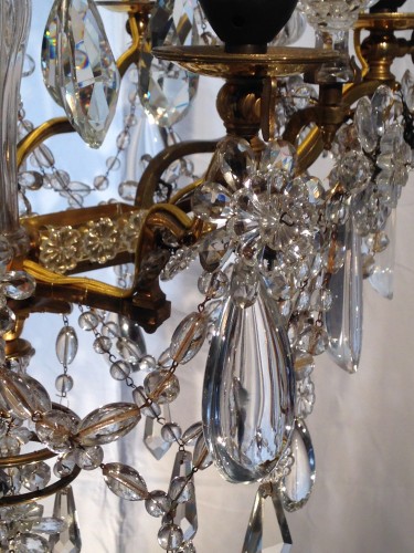 Lighting  - A French gilt bronze and crystal six light chandelier, circa 1850