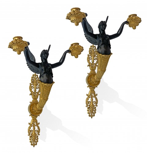 A pair of two-light Empire ormolu wall-lights attributed to Claude Galle