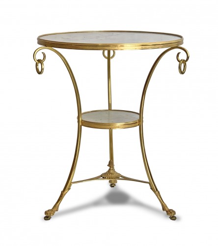 A neoclassical gilt-bronze gueridon with Carrara marble top