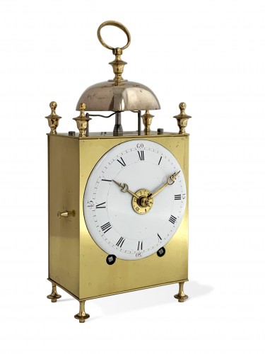 A Louis XVI brass capucine clock