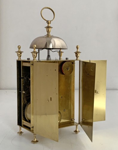  - A Louis XVI brass capucine clock