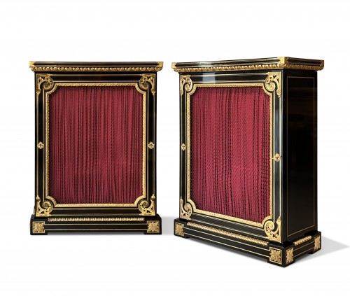 A pair of ormolu mounted ebonised cabinet after André Charles Boulle 