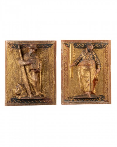 A Pair Of Carved Spanish Panels