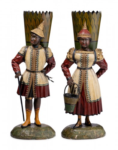A pair of painted tole figures