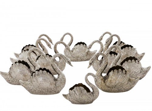 A set of twelve silver and silver gilt swans