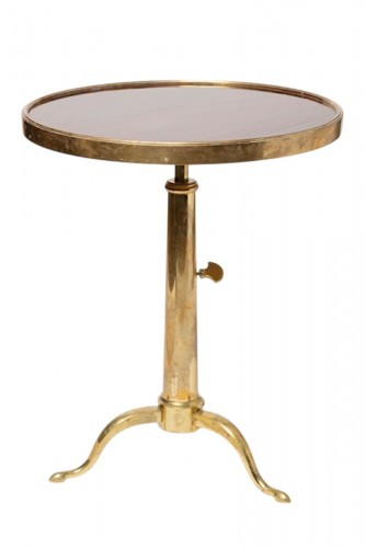A telescopic brass and mahogany gueridon by Maison Meilleur