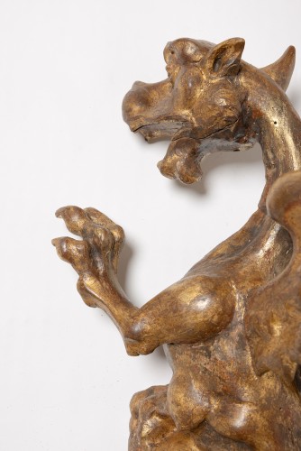 Decorative Objects  - A pair of Italian Rococo period gilt wood winged dragons