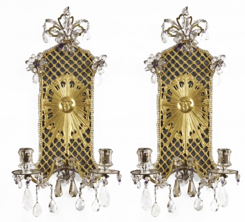 A pair of German 18th century ormolu and rock crystal wall lights