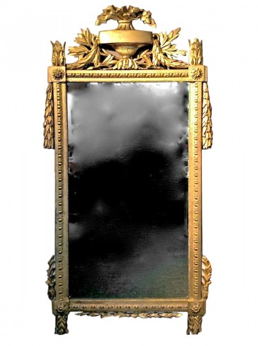 Miroir en bois sculpté et doré d'époque Louis XVI