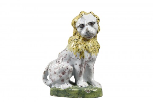 Saint Omer faience lion seated on a small mound