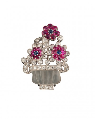 White gold floral brooch with rock crystal, diamond, rubies and saphirs