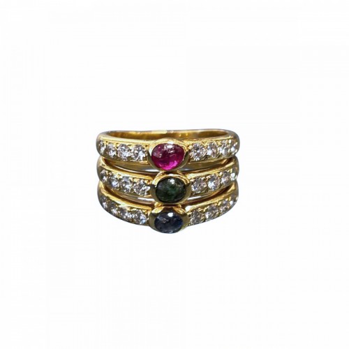 Gold ring set with diamonds, rubies, sapphires, and emeralds.