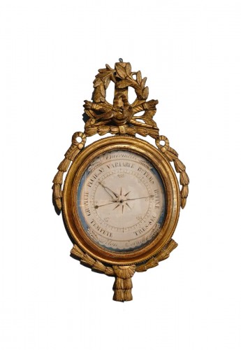 Barometer from the Louis XVI period in carved and gilded wood