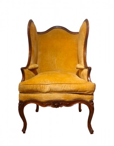 Large Louis XV wing chair in walnut from