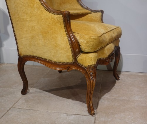 Large Louis XV wing chair in walnut from - 