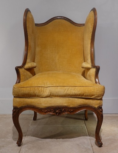 Antiquités - Large Louis XV wing chair in walnut from