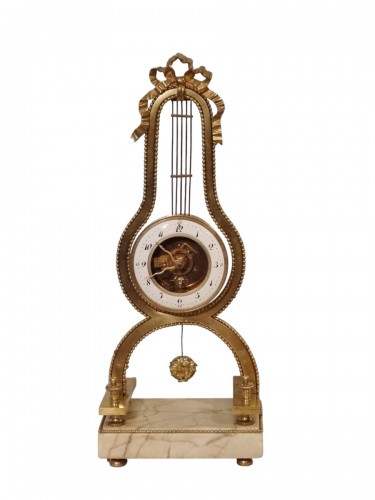 Pendule lyre en bronze doré