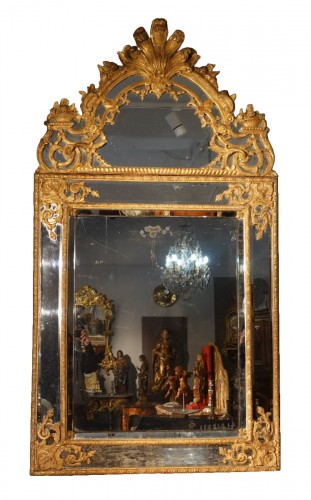 Large Regency mirror with glazing beads in gilded wood, 18th century