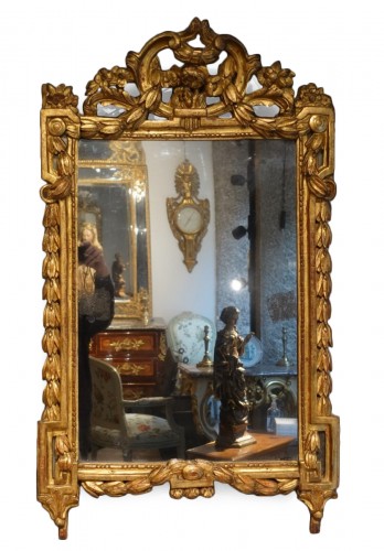 Louis XVI mirror in gilded wood