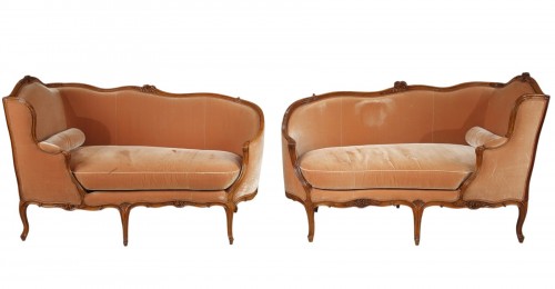 Rare pair of "veilleuse" sofas attributed to Louis Delanois